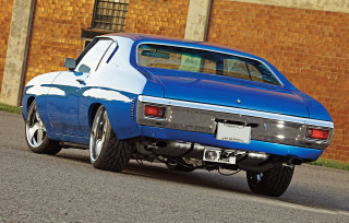 Blue car parked road brick - a brick wall behind free wallpaper
