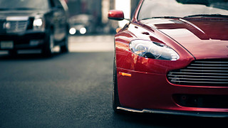 Red car parked road next - other car behind free wallpaper