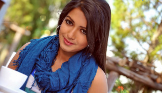 Woman blue scarf coffee tree - her hand and a tree in the background free wallpaper