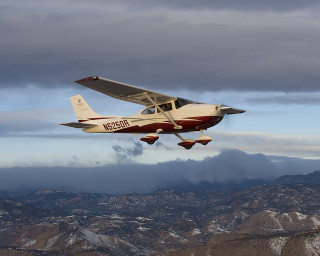 Small plane mountain range cloudy - alson s. clark free wallpaper
