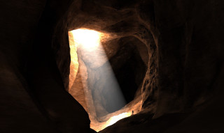 Light shines narrow opening rock - a light beam free wallpaper