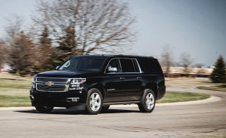 Black suv driving road tree - a black suv free wallpaper