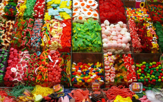 Colored candies sweets display table - rasquache free wallpaper