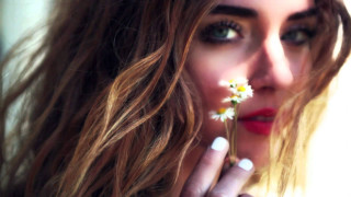 Woman long hair holding flower 3 - long hair holding free wallpaper