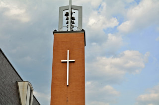 Tall brick tower cross clock - a cross free wallpaper