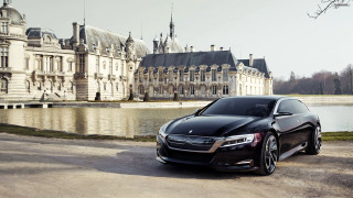 Black car large building lake - a castle in the background free wallpaper for desktop