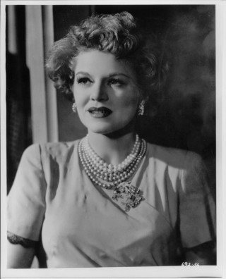 Woman necklace pearls black white - a window behind her free wallpaper for mobile