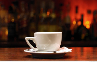Coffee cup saucer spoon bar - a table in front free wallpaper