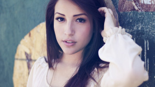 Woman long hair leaning wall 3 - a necklace free wallpaper