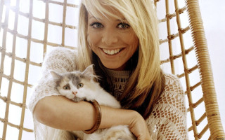 Woman holding cat smiling camera - daphne allen free wallpaper