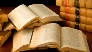 Stack of books on wooden - a wooden table next free wallpaper