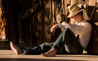 Man sitting straw hat jeans - a wooden door free wallpaper