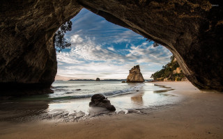Beach cave person cloudy ocean - a view of the ocean free wallpaper