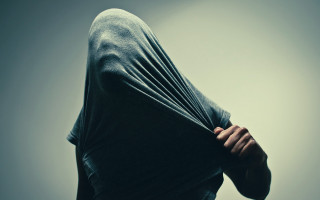 Hoodie serious person hands behind - their back free wallpaper for desktop