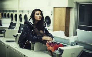 Woman laundry machine laptop stack - a laptop free wallpaper