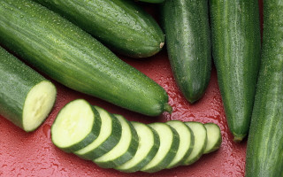 Cucumbers red surface slices cut - a red surface free wallpaper for desktop