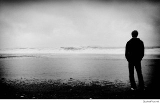 Man beach ocean wave standing 2 - somber free wallpaper