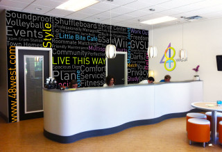 Reception white counter black white - a woman sitting free wallpaper