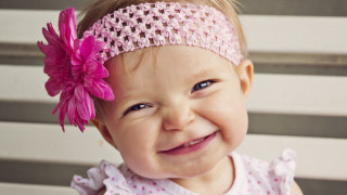 Little girl pink flower smiling - a little girl free wallpaper