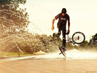 Man bike tricks water hoses - brian fies free wallpaper