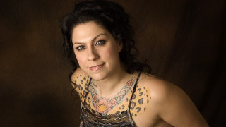 Woman tattoo chest posing brown - a black backdrop free wallpaper