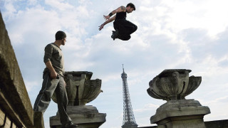 Man jumping off ledge eiffel - action scene free wallpaper