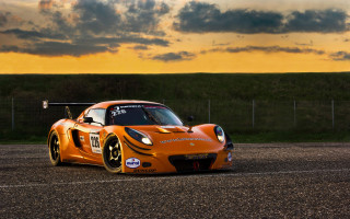 Sports car sunset road clouds - a sports car free wallpaper