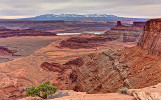Mountain lake snow capped range - a view of a mountain range free wallpaper