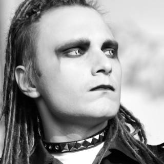 Man dreadlocks tie looking up - gothic free wallpaper for tablet