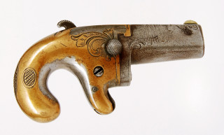 Gun handlebar closeup folkart flemish - a close up of a gun free wallpaper