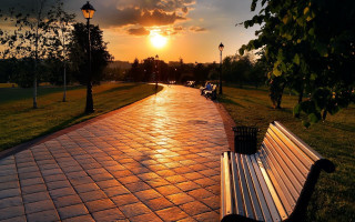 Park bench brick walkway sunset - a park bench free wallpaper