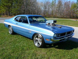 Blue car parked green field - clean free wallpaper