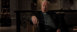 Man priest outfit holding glass - institutional free wallpaper