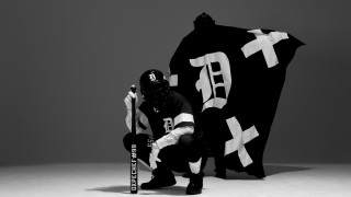 Man kneeling giant black flag - a bat free wallpaper for desktop