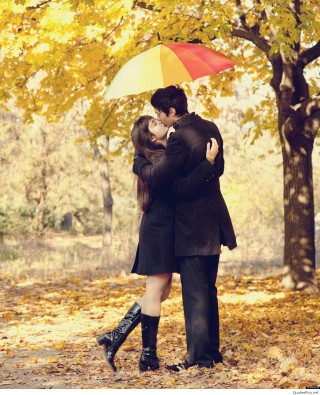 Romantic embrace autumn leaves park - a man and woman free wallpaper for mobile