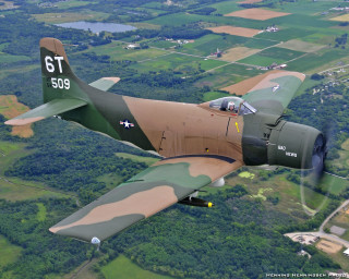Military plane flying lush green - a military plane free wallpaper