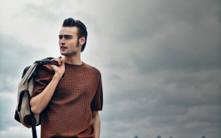 Man backpack cloudy sky building - contemporary fashion free wallpaper