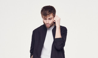 Bearded man black jacket phone - a beard free wallpaper