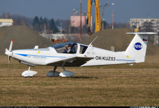 Small airplane grass field building - front view free wallpaper