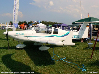 Small plane parked grass tents - filter free wallpaper
