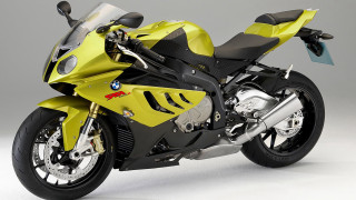 Yellow motorcycle white surface gray - a yellow motorcycle free wallpaper