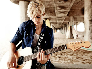 Man holding guitar beach pier - alvan fisher free wallpaper