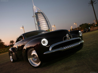 Black car tall building night - an art deco sculpture free wallpaper