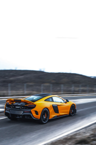 Yellow sports car desert highway - motion blur free wallpaper for mobile