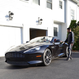 Man black car white building - free cars wallpaper for tablet