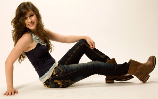 Woman smiling boots jeans sitting - photoshoot free wallpaper