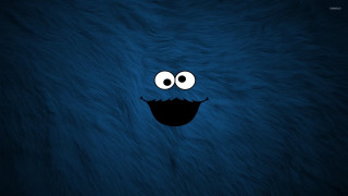 Blue furry animal smiling face - face and mouth free wallpaper