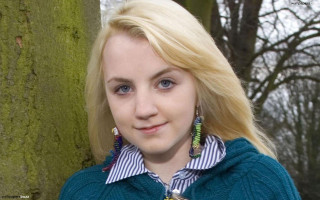 Blonde woman blue sweater forest - a green sweater free wallpaper