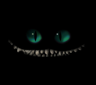 Black background green eyes smile - free halloween wallpaper for tablet