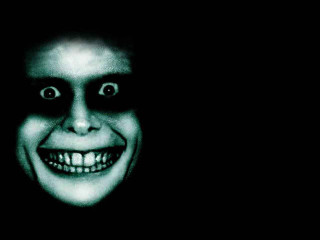 Creepy man smile dark background - a creepy looking man free wallpaper